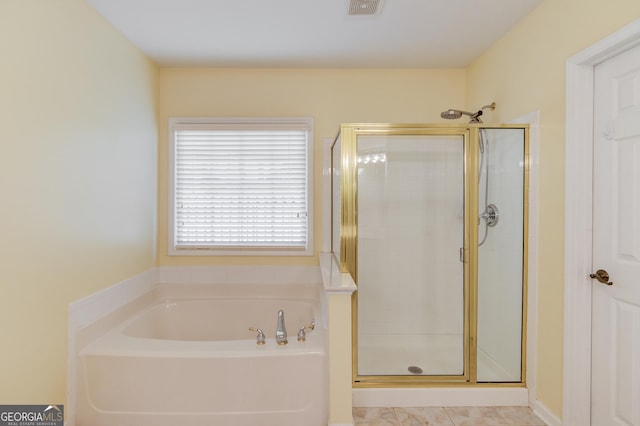 full bath with visible vents, a stall shower, and a bath