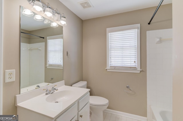 bathroom featuring vanity, baseboards, visible vents, shower / bathing tub combination, and toilet