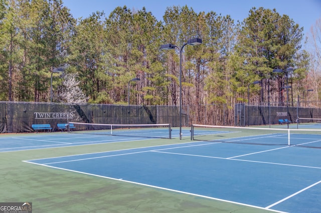 view of sport court featuring community basketball court and fence