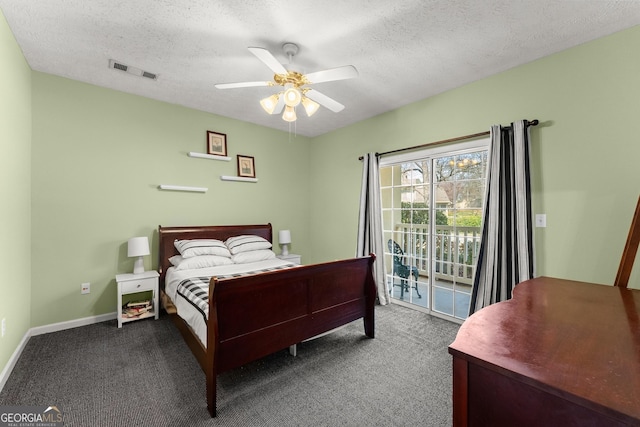 carpeted bedroom featuring access to exterior, visible vents, ceiling fan, baseboards, and a textured ceiling