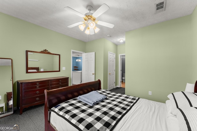 bedroom featuring ceiling fan, visible vents, dark colored carpet, and a textured ceiling