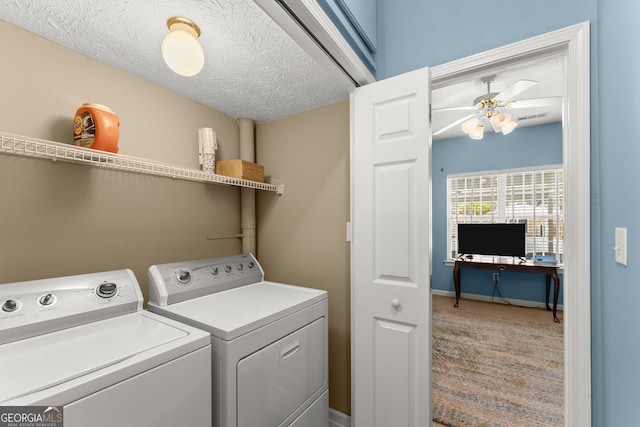 clothes washing area featuring a ceiling fan, laundry area, separate washer and dryer, and a textured ceiling