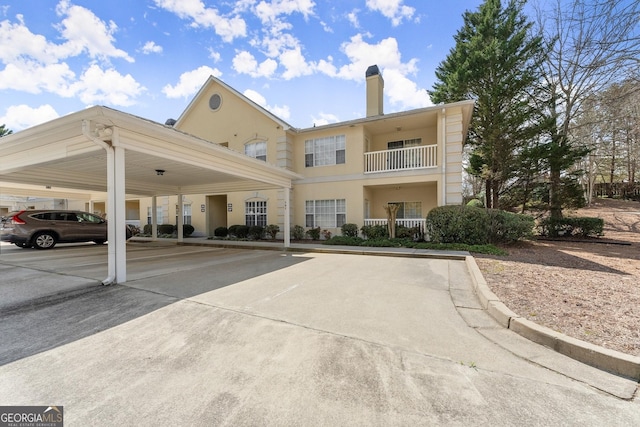 view of property with covered parking