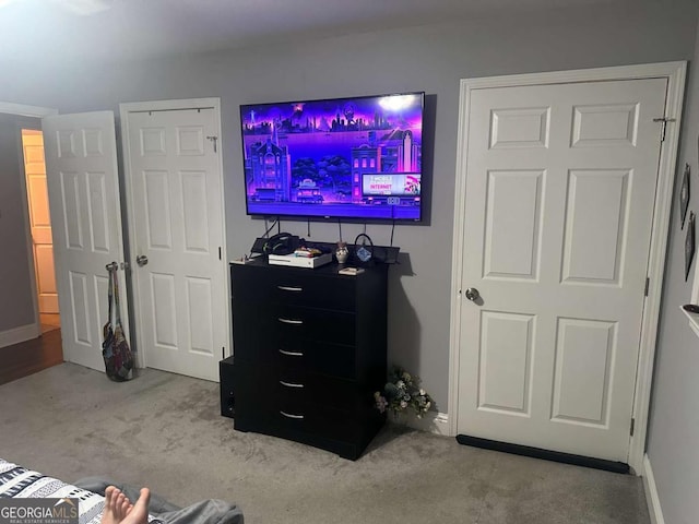 carpeted bedroom featuring baseboards