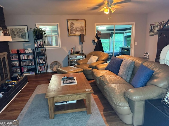 living area with wood finished floors and a ceiling fan