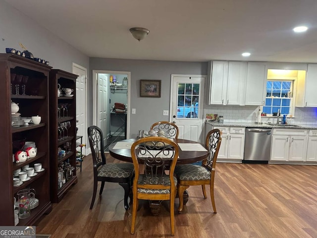 dining space with recessed lighting and wood finished floors