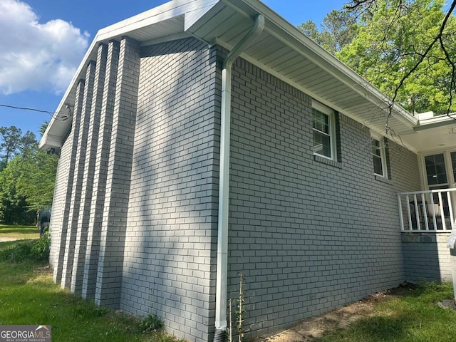 view of property exterior featuring brick siding