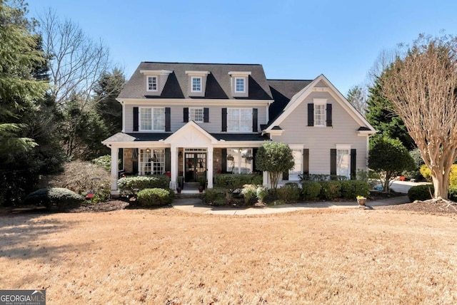 view of front of property with stone siding and a porch