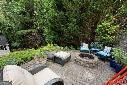 view of patio with an outdoor fire pit