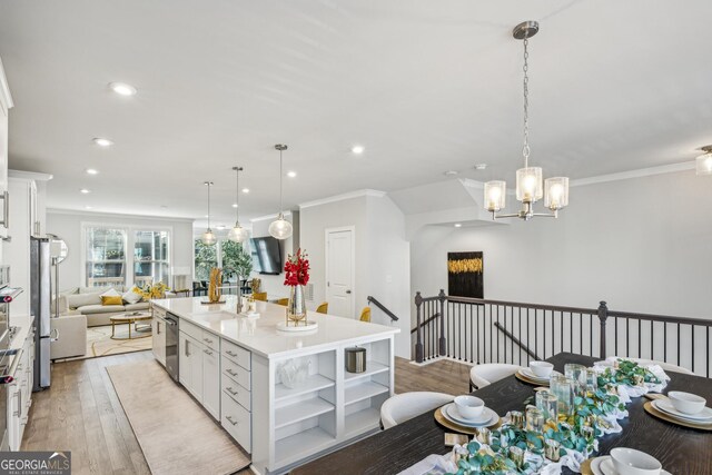 1322 Stanley Park Dr, Decatur, GA 30033 - kitchen with a sink, open shelves, light wood-style floors, and crown molding