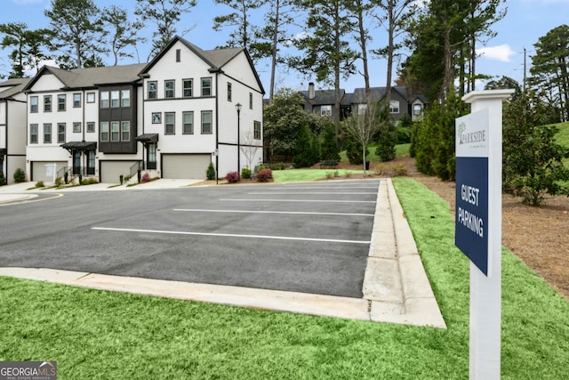 1322 Stanley Park Dr, Decatur, GA 30033 - uncovered parking lot featuring a residential view