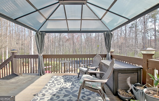 deck featuring a view of trees