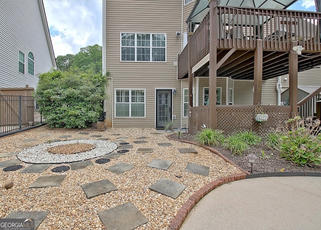 65 Tapestry Ln, Newnan, GA 30265 - rear view of property featuring a deck, fence, and a patio area