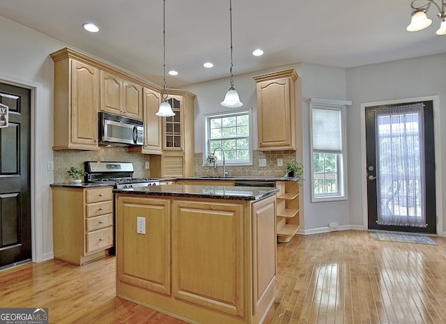 65 Tapestry Ln, Newnan, GA 30265 - kitchen featuring stainless steel appliances, light brown cabinets, a sink, light wood-style floors, and recessed lighting