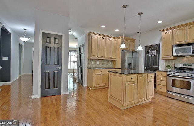 65 Tapestry Ln, Newnan, GA 30265 - kitchen featuring appliances with stainless steel finishes, light brown cabinets, light wood finished floors, a center island, and recessed lighting