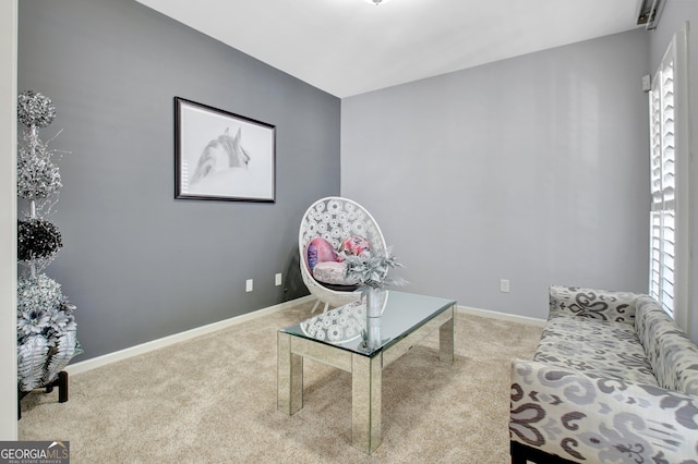 living area with carpet flooring and baseboards