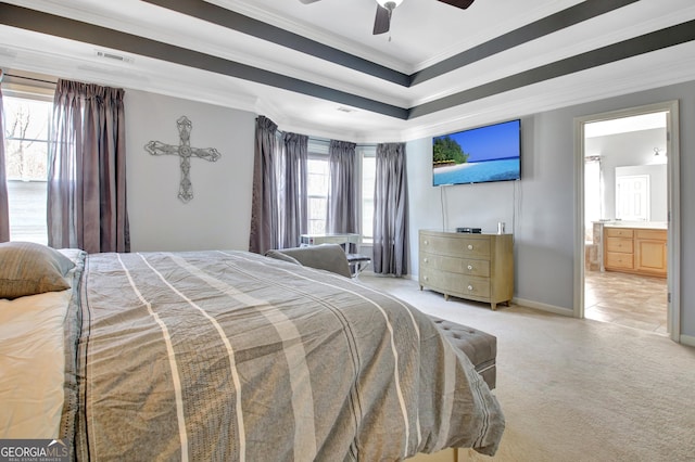 bedroom with crown molding, light carpet, a raised ceiling, ensuite bathroom, and baseboards