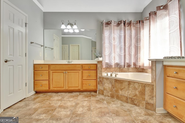 bathroom featuring a garden tub, vanity, stone finish floors, a chandelier, and crown molding
