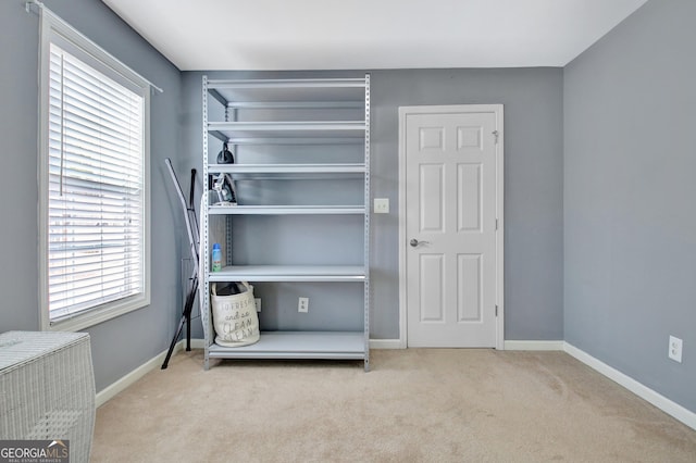 unfurnished bedroom with carpet flooring and baseboards