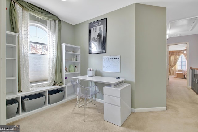 office featuring carpet floors, attic access, and baseboards
