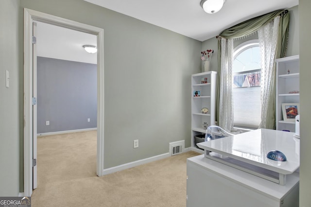 office space featuring light colored carpet and baseboards