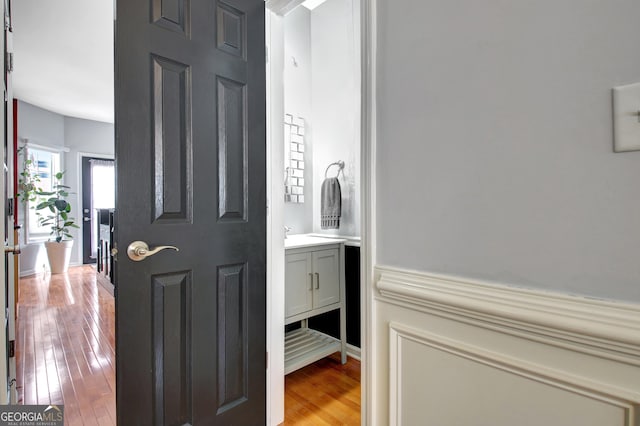 bathroom featuring vanity and hardwood / wood-style flooring