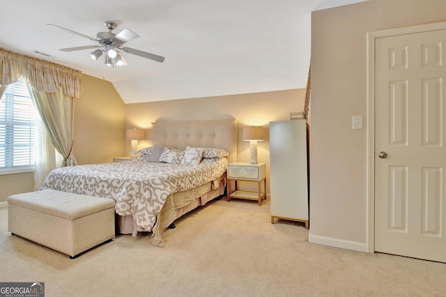carpeted bedroom with baseboards, ceiling fan, and vaulted ceiling
