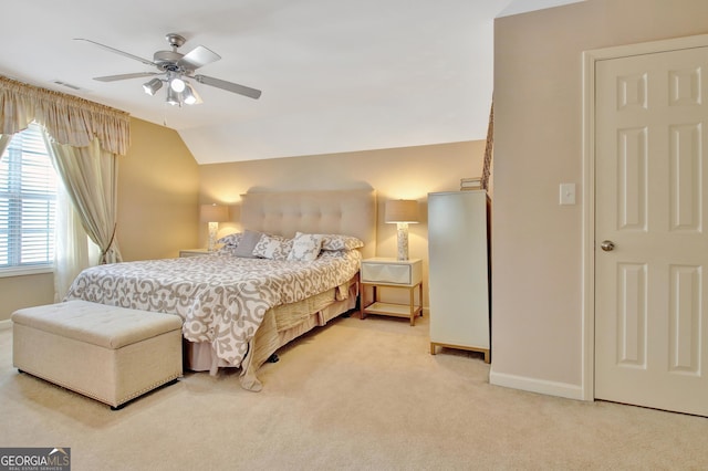 bedroom featuring visible vents, carpet floors, baseboards, ceiling fan, and vaulted ceiling