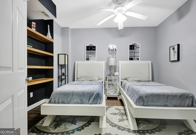 bedroom featuring wood finished floors and a ceiling fan