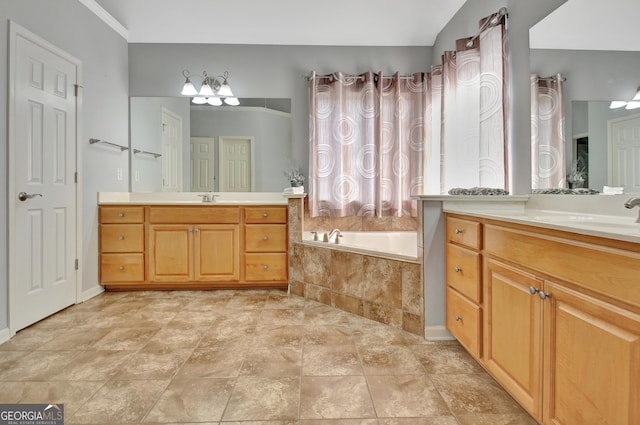 bathroom with two vanities, a bath, and a sink