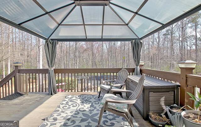 wooden terrace featuring a gazebo
