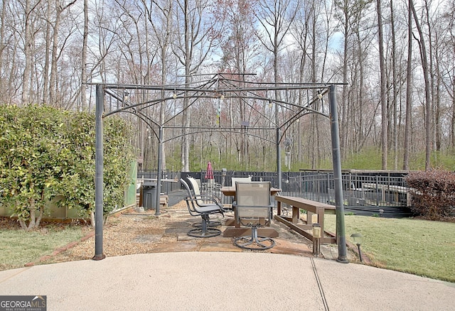 view of patio / terrace featuring fence