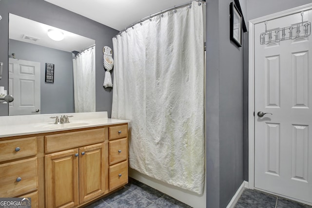 full bath featuring visible vents, baseboards, a shower with curtain, tile patterned floors, and vanity