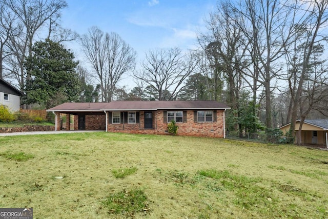 ranch-style home with a carport, brick siding, and a front yard