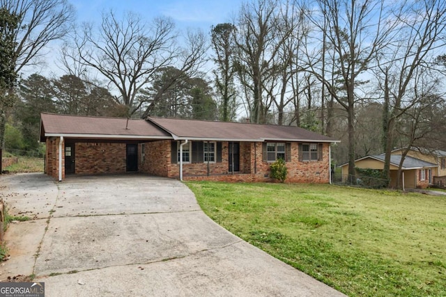 single story home with a front yard, a carport, and driveway