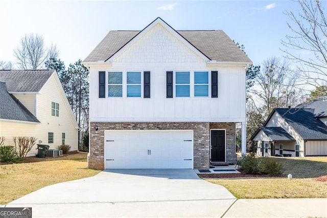view of front of home with brick siding, an attached garage, board and batten siding, a front lawn, and driveway