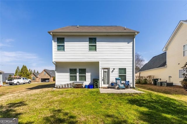 back of property with a patio and a lawn