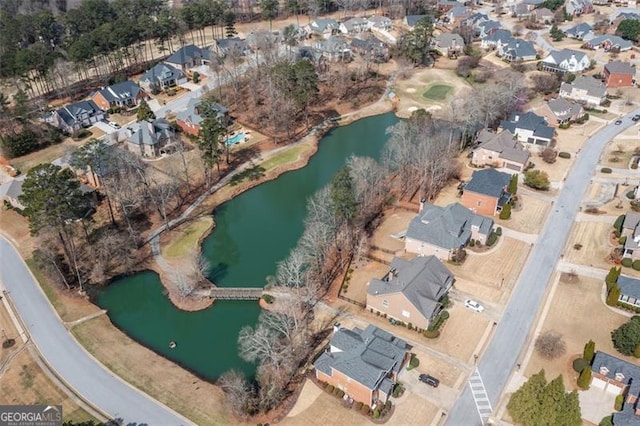 bird's eye view featuring a water view and a residential view