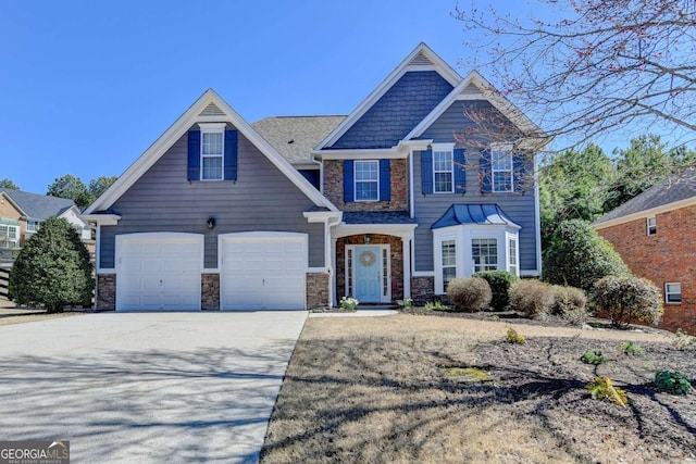 craftsman-style home featuring stone siding and driveway