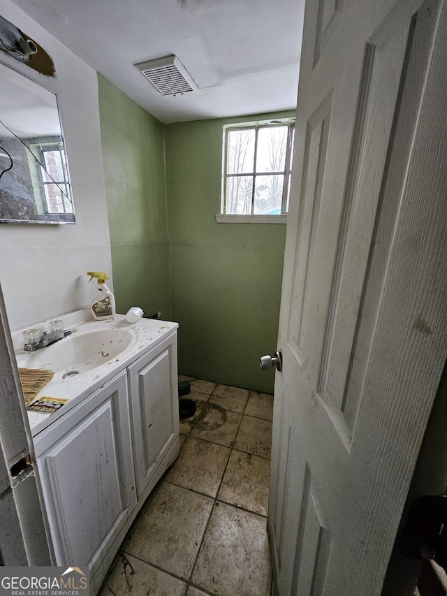 bathroom with visible vents and vanity