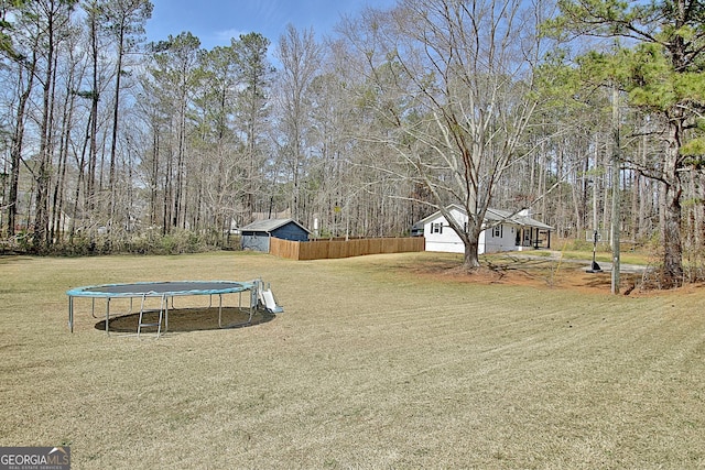 view of yard featuring a trampoline