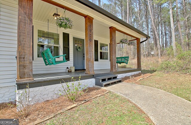 entrance to property with a porch