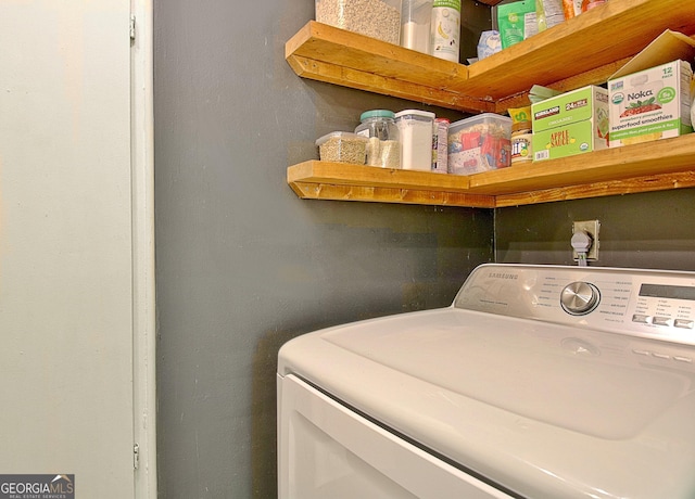 washroom featuring laundry area and washer / clothes dryer