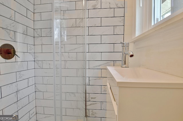 bathroom with a tile shower