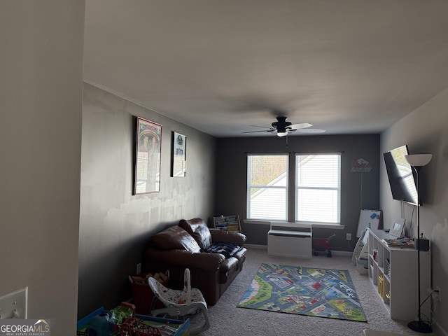 rec room with baseboards, a ceiling fan, and carpet flooring