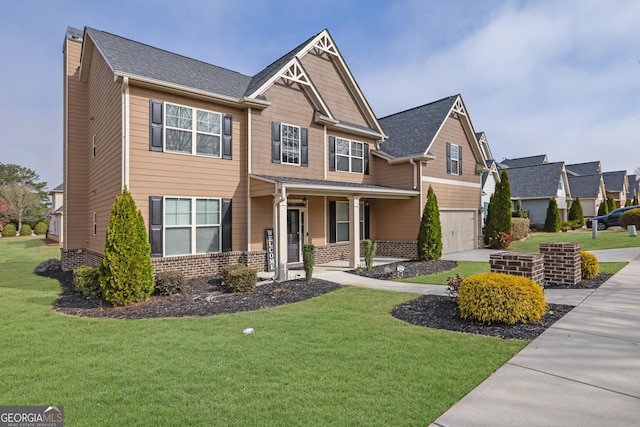 craftsman-style house featuring concrete driveway, a garage, covered porch, and a front lawn