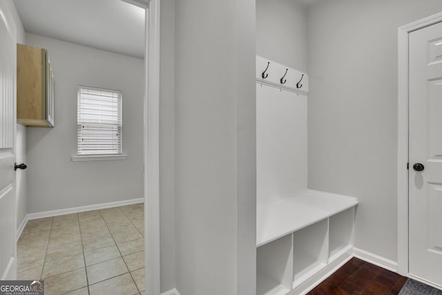 mudroom featuring tile patterned flooring and baseboards