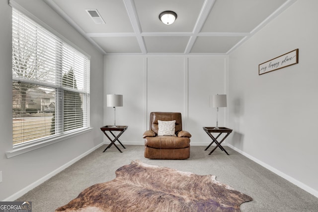 sitting room with visible vents, baseboards, carpet, beamed ceiling, and coffered ceiling