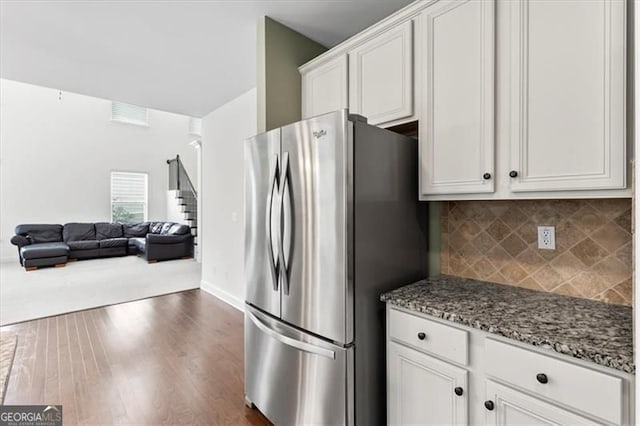 5310 Corinth Ct, Cumming, GA 30040 - kitchen with freestanding refrigerator, dark wood finished floors, stone counters, white cabinets, and open floor plan