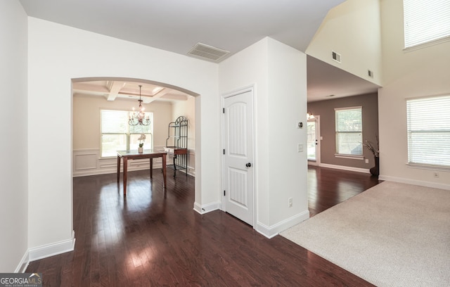 5310 Corinth Ct, Cumming, GA 30040 - hallway with visible vents, arched walkways, an inviting chandelier, and dark wood finished floors